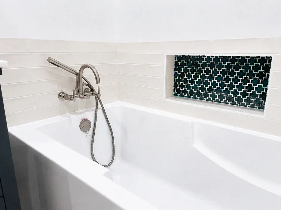 Tub filler and glass mosaic niche detail — YKCA Bay Area remodel