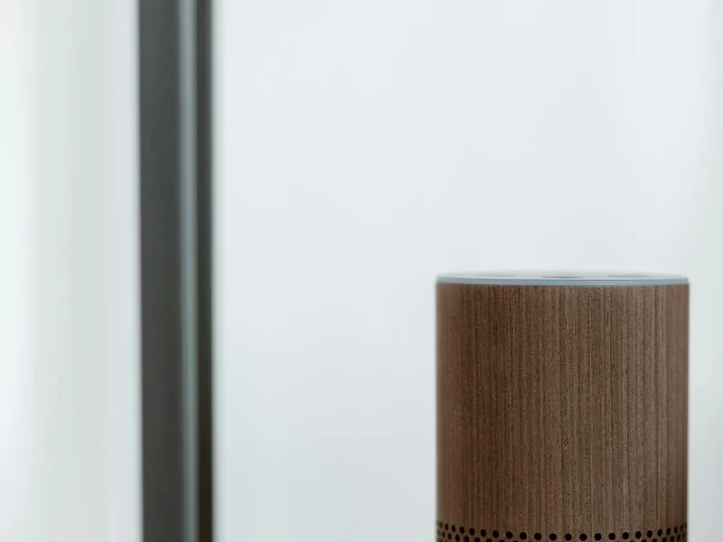 Wireless smart speaker on a shelf in a residential setting